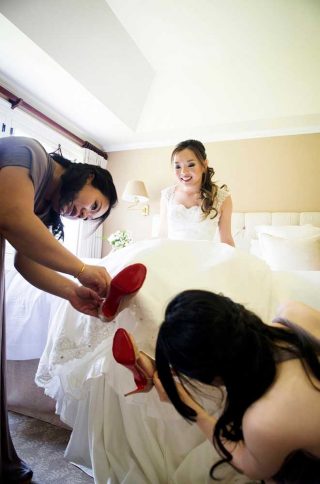 Bride getting prepared for her wedding at Langdon Hall, Cambridge.