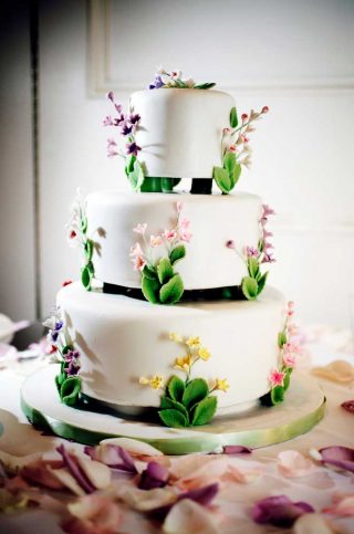 Triple-decker wedding cake with white icing for a wedding at Langdon Hall.
