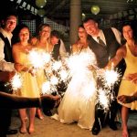 Guests holding sparklers and partying at a Guelph wedding reception.