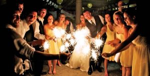 Guests holding sparklers and partying at a Guelph wedding reception.